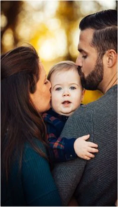 Family Kissing Pose In The Park